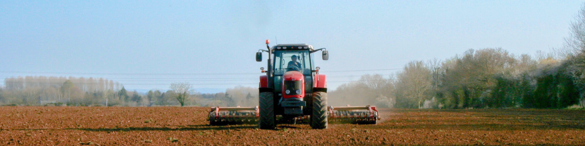 Tractor and farmer working in the field